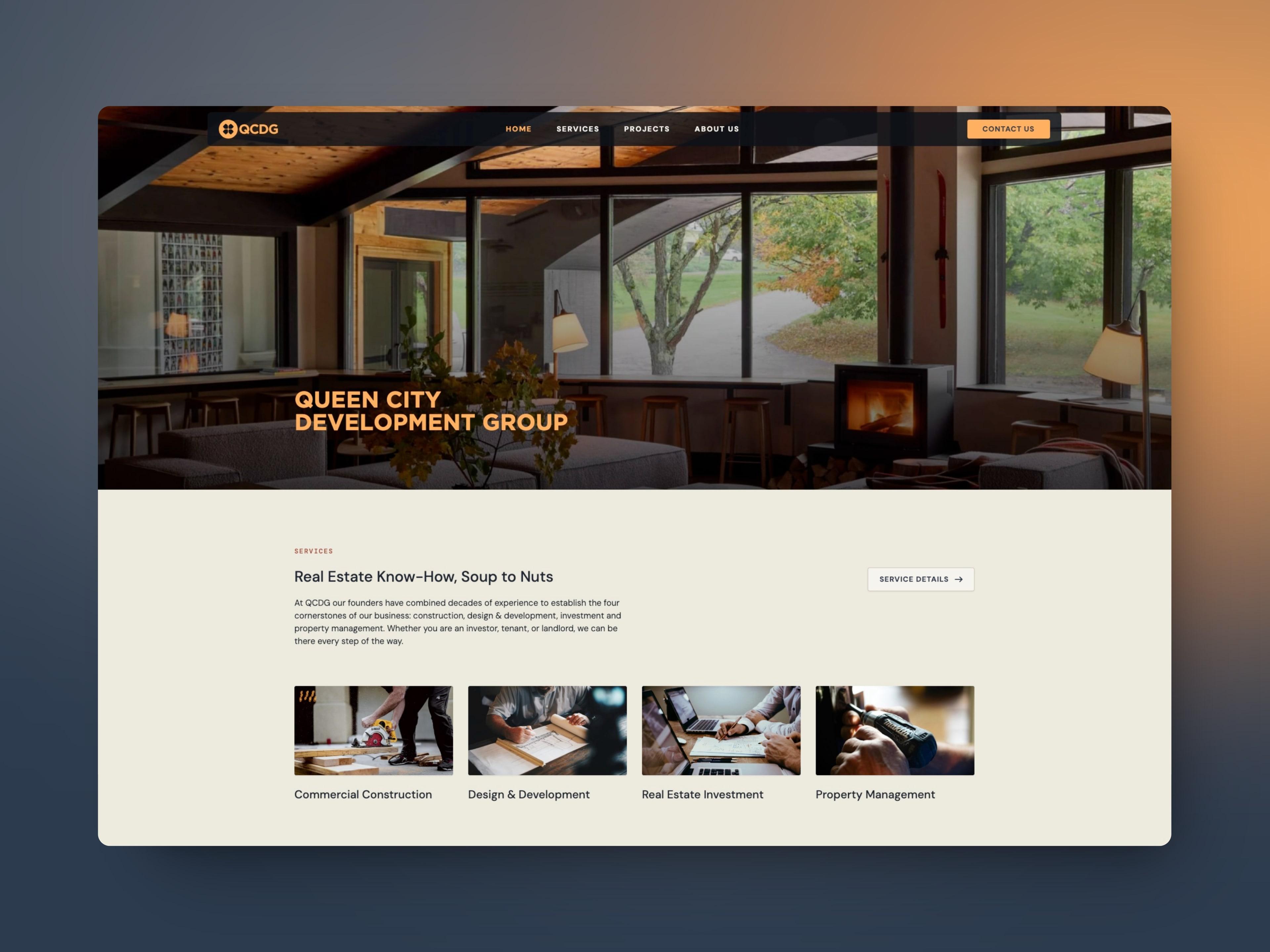 The Queen City Development Group homepage in a browser window: a dim, timber-framed living room with a wood stove behind the name in orange capitals, above a Services section with four photo cards.